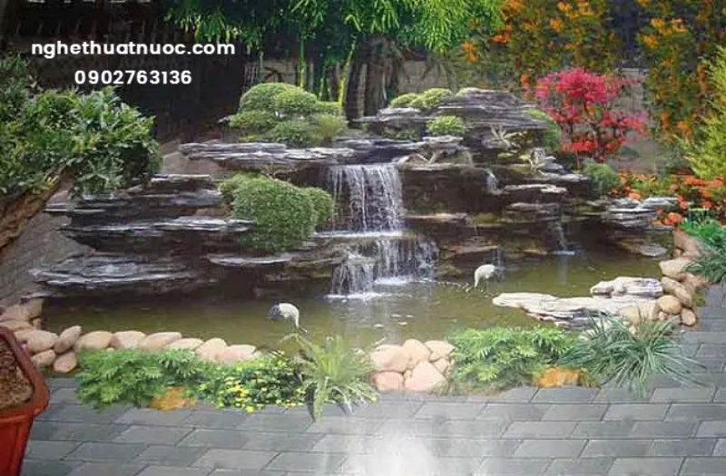 Hòn Non Bộ Thác Nước: Nghệ Thuật Cảnh Quan & Phong Thủy Đẳng Cấp Hòn non bộ thác nước đẹp kết hợp hồ cá Koi ngoài trời chuẩn phong thủy