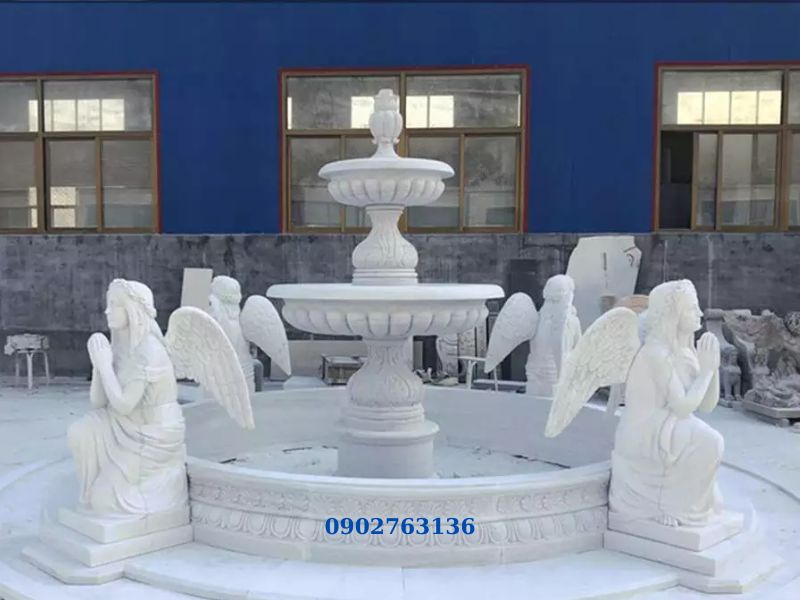 Mẫu Đài Phun Nước Hình Tròn: Ý nghĩa phong thủy & Tư vấn thiết kế Mẫu đài phun nước bể tròn bằng đá tự nhiên có tượng thiên thần nghệ thuật.